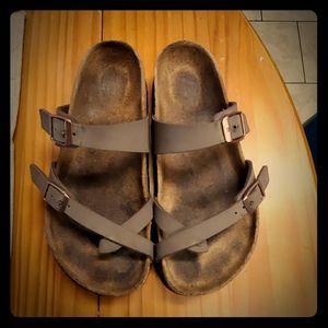 Brown birkenstock sandles.